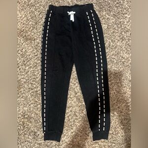 Justice joggers. Black with white justice detail down the side. Size 12.